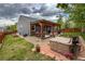 Backyard featuring a wooden pergola, hot tub, and mature trees for added privacy at 13642 Wrangler Way, Mead, CO 80542