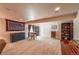 Spacious finished basement with carpet flooring, seating area, and multiple furnishings at 13642 Wrangler Way, Mead, CO 80542