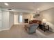 A finished basement featuring a seating area, television, and table lamps at 13642 Wrangler Way, Mead, CO 80542