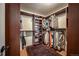 A spacious walk-in closet featuring custom built-ins and ample storage space at 13642 Wrangler Way, Mead, CO 80542