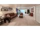 Spacious living room with plush seating, carpet, and ample lighting fixtures at 13642 Wrangler Way, Mead, CO 80542