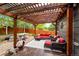 Inviting covered patio with comfortable seating and a hot tub, perfect for outdoor relaxation and entertaining at 13642 Wrangler Way, Mead, CO 80542