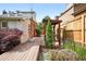 Backyard design with a wooden deck, pergola, and thoughtfully designed landscaping at 4729 W 32Nd Ave, Denver, CO 80212