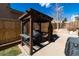 Backyard wooden pergola, showcasing outdoor barbecue grill, offering relaxing backyard experience at 4729 W 32Nd Ave, Denver, CO 80212