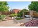 Expansive backyard deck with pergola-covered seating area, lush landscaping, and privacy fencing at 4729 W 32Nd Ave, Denver, CO 80212