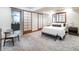 Serene bedroom featuring soft carpet, a sliding door and a comfortable bed with plush bedding at 4729 W 32Nd Ave, Denver, CO 80212