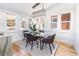 Inviting dining room bathed in natural light, featuring a modern table set and contemporary decor at 4729 W 32Nd Ave, Denver, CO 80212