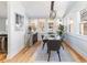 Charming dining area with hardwood floors, a stylish table set, and natural light, creating a warm and inviting space at 4729 W 32Nd Ave, Denver, CO 80212