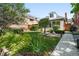 A verdant front yard is beautifully landscaped with lush grass and garden area at 4729 W 32Nd Ave, Denver, CO 80212