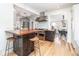 Contemporary kitchen with hardwood floors, stainless steel appliances and an open breakfast bar at 4729 W 32Nd Ave, Denver, CO 80212