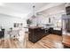 Open-concept kitchen with modern cabinets, stainless steel appliances, and a large island with seating at 4729 W 32Nd Ave, Denver, CO 80212