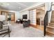 Cozy living room with neutral tones, sliding doors, and easy access to laundry at 4729 W 32Nd Ave, Denver, CO 80212