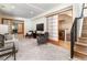 Spacious living room with fireplace, modern furniture, and adjacent laundry area at 4729 W 32Nd Ave, Denver, CO 80212