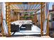 Relaxing outdoor pergola seating area featuring a stylish sectional and fire pit table at 4729 W 32Nd Ave, Denver, CO 80212