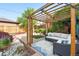 Stylish backyard pergola with comfortable seating, perfect for outdoor entertaining and relaxation at 4729 W 32Nd Ave, Denver, CO 80212