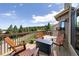 Enjoy outdoor living on this back deck with great views, seating, and a cozy fire pit at 24045 High Meadow Dr, Golden, CO 80401