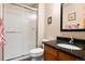 This bathroom has a granite vanity and a shower with sliding doors at 24045 High Meadow Dr, Golden, CO 80401