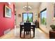Elegant dining room with a long wooden table, contemporary chandelier, and a large window with a view at 24045 High Meadow Dr, Golden, CO 80401