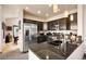 Modern kitchen with stainless steel appliances, dark cabinets, granite countertops, and tile flooring at 24045 High Meadow Dr, Golden, CO 80401