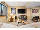 Comfortable living room featuring carpet, a TV, and large window providing natural light at 24045 High Meadow Dr, Golden, CO 80401