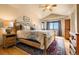 Main bedroom with natural light, wood floors, ceiling fan and decorative rug at 24045 High Meadow Dr, Golden, CO 80401