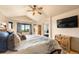 Spacious main bedroom with a king-size bed, ceiling fan, and great view at 24045 High Meadow Dr, Golden, CO 80401