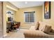 Cozy office space featuring a comfortable sofa, desk setup, and a well-lit window, perfect for work or relaxation at 24045 High Meadow Dr, Golden, CO 80401