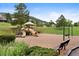 Community playground with slides, swings, and a covered play structure for children to enjoy at 24045 High Meadow Dr, Golden, CO 80401