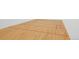 Indoor racquetball court with hardwood floors and regulation markings for competitive play at 24045 High Meadow Dr, Golden, CO 80401