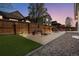 Backyard with a brick patio and a fire pit, great for outdoor entertaining at 7823 E 130Th Pl, Thornton, CO 80602