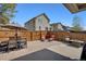 Spacious backyard with brick patio, fenced yard, and outdoor seating and dining area at 7823 E 130Th Pl, Thornton, CO 80602