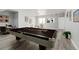 Finished basement with a billiard table and seating area, perfect for entertaining guests at 7823 E 130Th Pl, Thornton, CO 80602