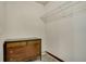 Walk-in closet with upper shelving and carpeted flooring, ideal for clothing and accessory storage at 7823 E 130Th Pl, Thornton, CO 80602