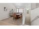Bright dining room featuring a chandelier, large windows, and a decorative bookshelf at 7823 E 130Th Pl, Thornton, CO 80602