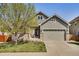 Charming two-story home with a well-manicured lawn and attached two-car garage at 7823 E 130Th Pl, Thornton, CO 80602