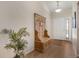 Bright foyer featuring hardwood floors, a decorative hall tree, and a welcoming ambiance at 7823 E 130Th Pl, Thornton, CO 80602