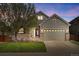 Charming two-story home with a well-maintained lawn and a two-car garage at 7823 E 130Th Pl, Thornton, CO 80602
