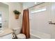 Bright bathroom featuring a shower-tub combo with a white tile surround and neutral walls at 3162 Grizzly Peak Dr, Broomfield, CO 80023