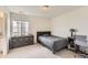 Well-lit bedroom with a large window, a comfortable bed, and built-in storage at 3162 Grizzly Peak Dr, Broomfield, CO 80023