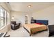 Cozy bedroom with a large window, comfortable seating, and soft carpeting at 3162 Grizzly Peak Dr, Broomfield, CO 80023