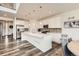 Modern kitchen featuring a large island, stainless steel appliances, and sleek white cabinetry at 3162 Grizzly Peak Dr, Broomfield, CO 80023