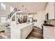 Bright, open kitchen with white cabinets, stainless steel appliances, and a large island at 3162 Grizzly Peak Dr, Broomfield, CO 80023