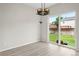 Dining room with laminate floors and a sliding door providing backyard access at 13983 E 104Th Pl, Commerce City, CO 80022