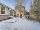 Backyard with patio, grill, and snowy landscape at 23975 E Arizona Pl, Aurora, CO 80018