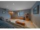 Basement living room with a window, wood accents, and comfortable seating at 11222 Conifer Mountain Rd, Conifer, CO 80433