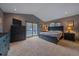 Bedroom featuring a comfortable bed, dresser, and sliding doors to a private outdoor deck at 11222 Conifer Mountain Rd, Conifer, CO 80433