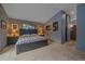 Serene bedroom with a queen-size bed, stylish gray walls, and plenty of natural light at 11222 Conifer Mountain Rd, Conifer, CO 80433