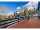 Wood deck with stunning views, perfect for relaxing and enjoying the outdoors with a chiminea at 11222 Conifer Mountain Rd, Conifer, CO 80433