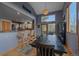 Stylish dining area open to the kitchen with seating for 6 and lots of natural light at 11222 Conifer Mountain Rd, Conifer, CO 80433