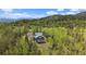 Charming home with scenic mountain views and a spacious deck, perfect for outdoor living at 11222 Conifer Mountain Rd, Conifer, CO 80433